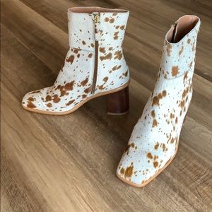 Sleek cow hide heeled boot with a square toe